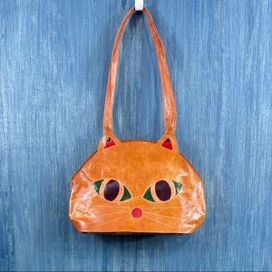 Cute and eccentric brown leather bag with cat face